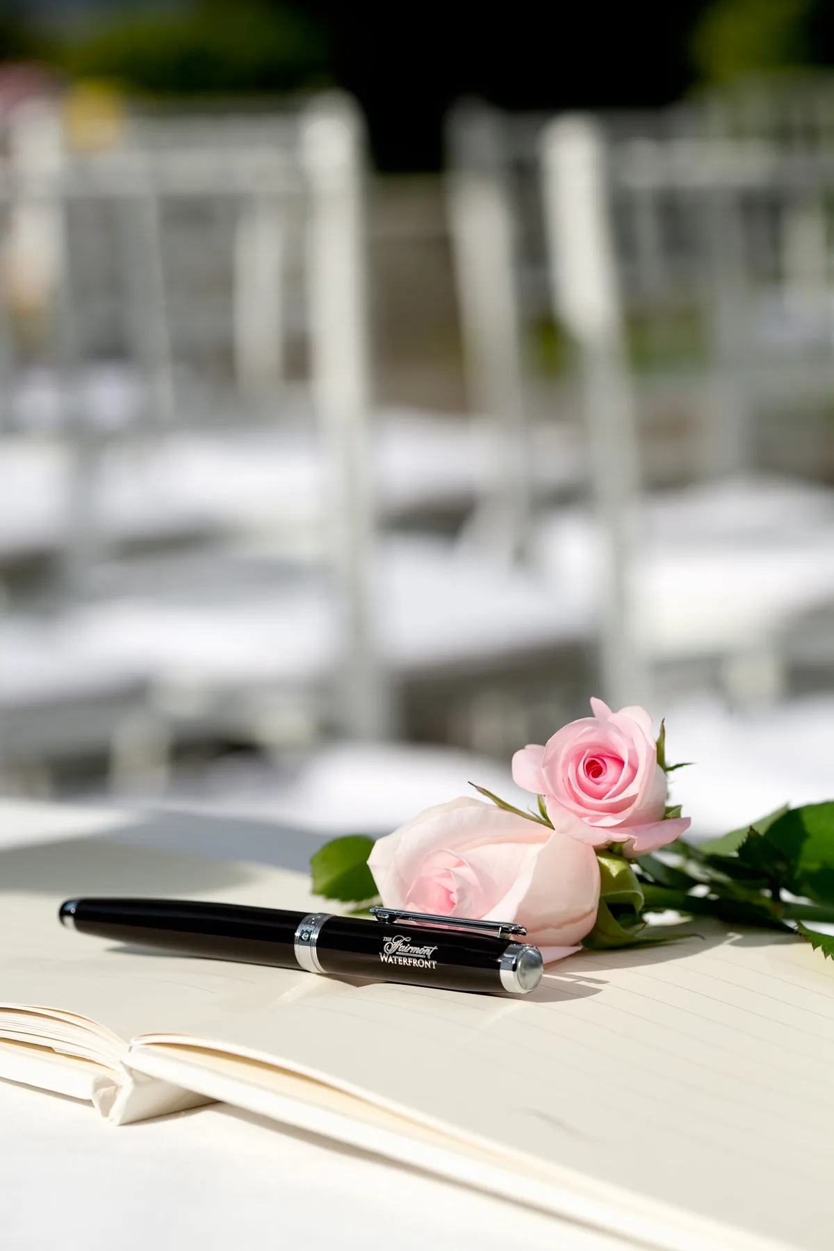 Signing a wedding guestbook at the Fairmont Waterfront Hotel Vancouver