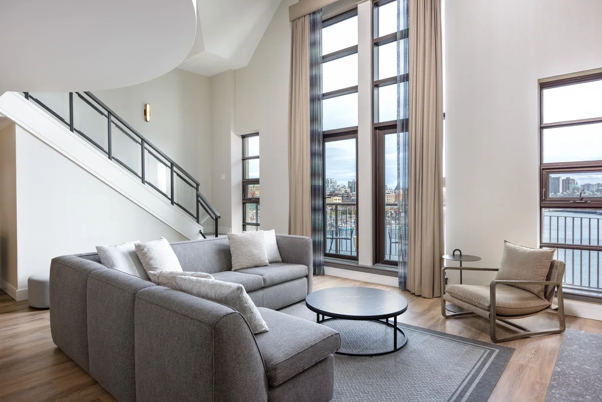 The living room of the split level Presidential Suite at the Delta Ocean Pointe Resort in Victoria, BC